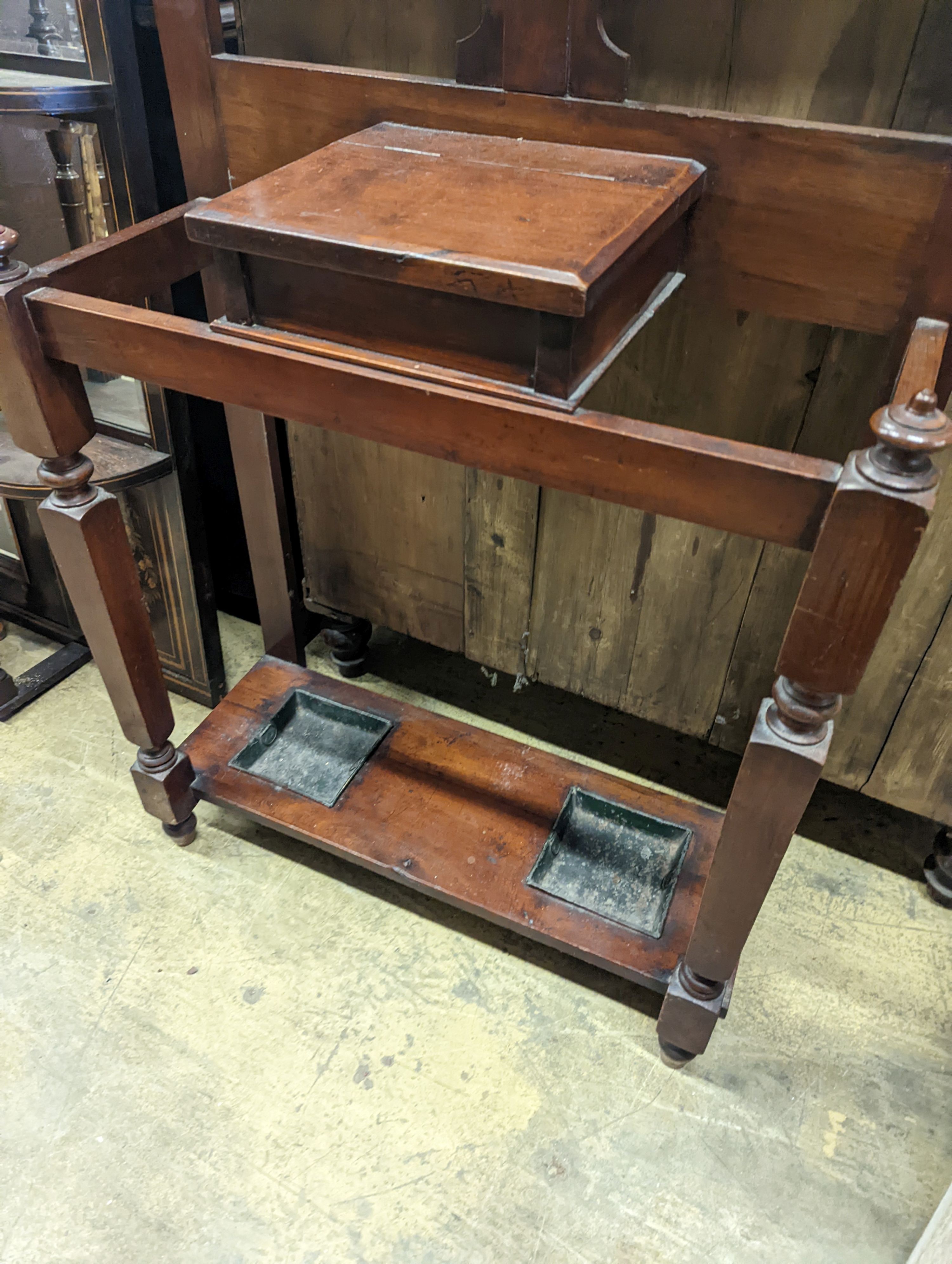 A late Victorian walnut hallstand, length 75cm, depth 30cm, height 203cm